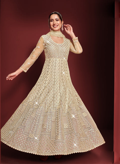 Imposing Baige Colored Partywear Embroidered Netted Anarkali Suit