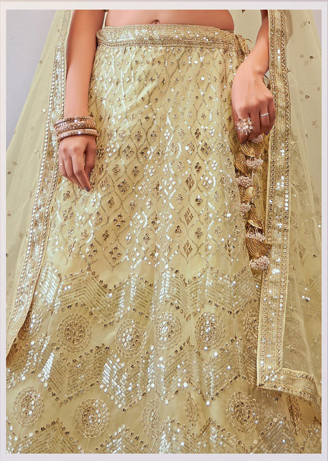 Exceptional Cream Colored Partywear Embroidered Net Lehenga Choli