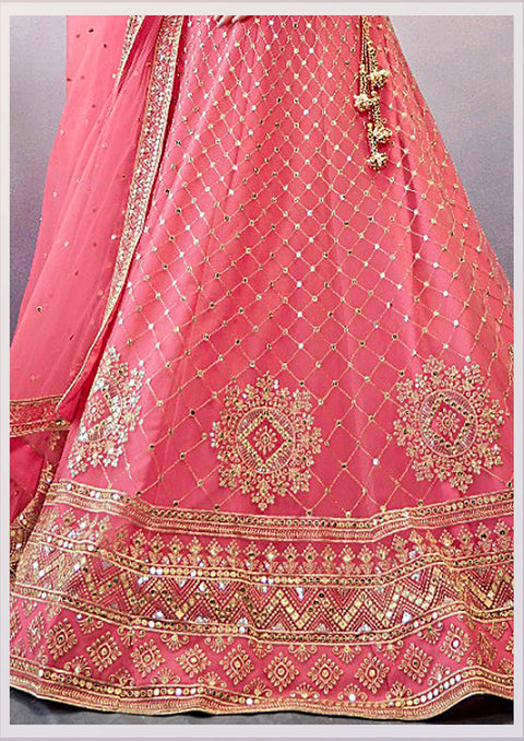Stunning Pink Colored Partywear Embroidered Netted Lehenga Choli