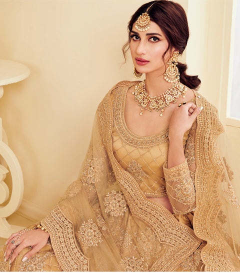 Golden Heavy Embroidered Wedding Net Lehenga Choli